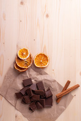 pieces of dark cocao chocolate on rustic surface