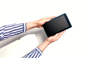 Woman using a tablet computer from above