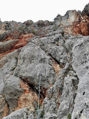 a rope on the rock for climbing