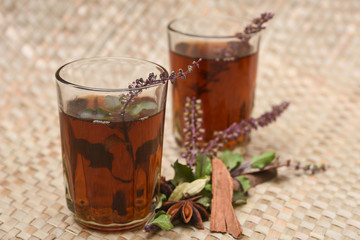 Indian Masala Chai black tea, traditional Tulsi herbal tea beverage with or without milk and spices Kerala India. Two cups organic ayurvedic  herbal drink India, good in winter for immunity boosting.