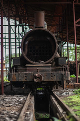 Bucay, Guayas / Ecuador - circa 2016 : An old red train storage with a black steam train locomotive