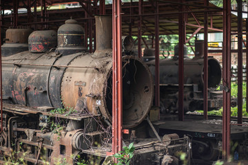 Bucay, Guayas / Ecuador - circa 2016 : An old red train storage with a black steam train locomotive