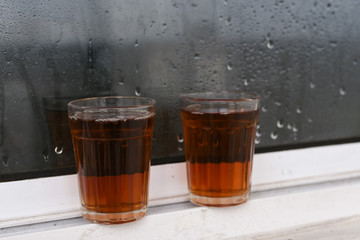 Indian Masala Chai black tea, traditional beverage with or without milk and spices Kerala India. Two cups of organic ayurvedic or herbal drink India, good in winter for immunity boosting.