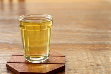 Detail of a glass of cachaça, a typical Brazilian drink. Brazilian export product, distilled drink known as brandy or drip. The national day of cachaça is September 13th.