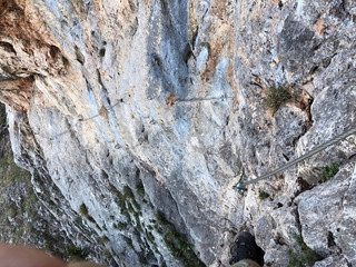 a rope on the rock for climbing