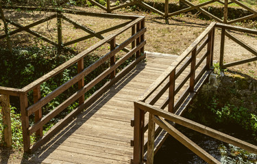 Fototapeta na wymiar high angle view of wooden footbridge in Posta Fibreno nature reserve in the Italian national park of Abruzzo,Lazio and Molise