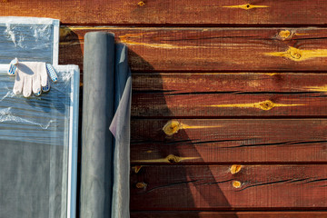 quito nets samples. On open air. The desktop on which the products will be assembled on the window. In the background a wooden background in retro burgundy color style