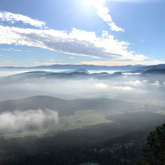 blue sky on the rock with fog in the valley