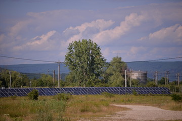 oil park near the solar panel farm. changing the environment in an ecological way 