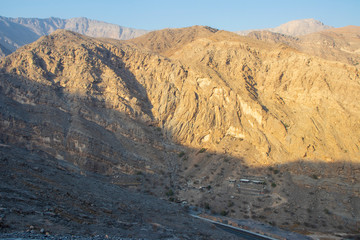 Fototapeta na wymiar Small settlement on the road to Jebael Jais mountain of Ras Al Khaimah emirate. United Arab Emirates, Outdoor