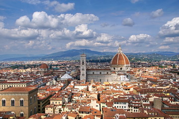Fototapeta na wymiar Cathedral of Santa Maria del Fiore and Bell Tower of Giotto. Florence, Italy. View from the tower of the Palazzo Vecchio.