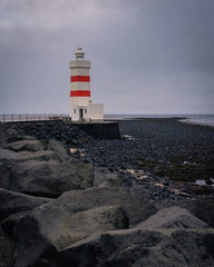 lighthouse on the shore of the sea
