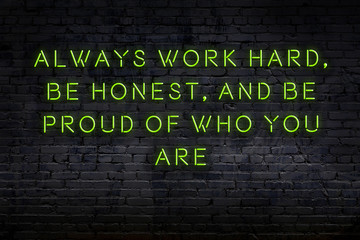 Wise quote. Neon inscription against brick wall