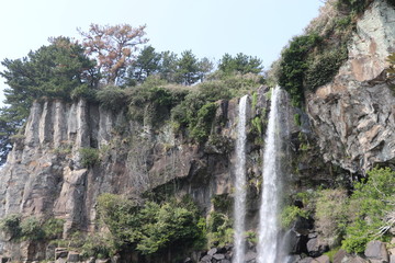 Fototapeta na wymiar Jeongbang Waterfall on Jeju Island