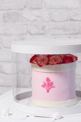 Wedding Flower  Box Cake, covered with light pink fondant and decorated with pink roses, on a light...