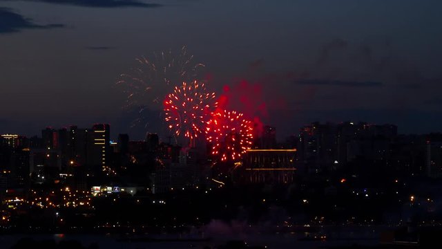 Firework with cityscape at twilight time