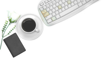 White office desk, top view with coffee laptop, white flower notebook, flat lay glasses with free space