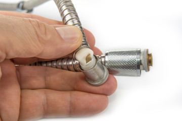 Broken shower hose on a white background