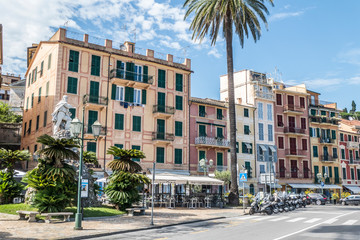 Colorful facades in Santa Margherita Ligured and Giuseppe Garibaldi monument - obrazy, fototapety, plakaty