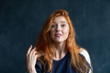 Beautiful woman portrait on blue background with emotions