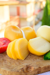 Cheese collection, Italian cheese scamorza made from cow milk in South Italy, white and yellow smoked.