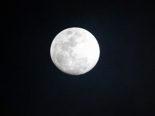 full moon over blue sky