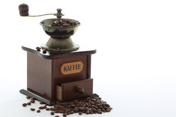 coffee grinder with beans isolated on background white