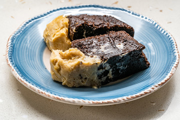 Belgium Chocolate Cake with Peanut Butter Cream served with Plate.