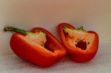 two halves of red paprika organic vitamins closeup