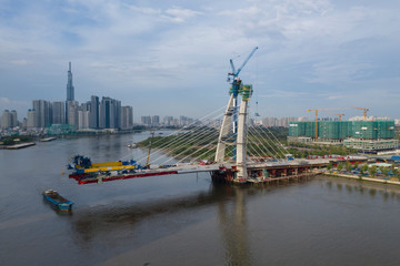 The Thu Thiem Two Bridge is a bridge under construction in Ho Chi Minh City. The bridge will span the Saigon River, connecting District One and District Two. Skyline is seen in the background