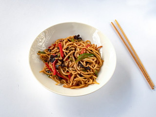 Noodles fried with chicken (noodles ,, chicken fillet, bell peppers, black mushrooms, ginger, bamboo, spices, sterling onions, garlic, soy sauce)