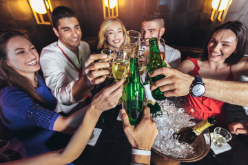 Happy young people having fun at nightclub.