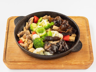 Vegetables on a hot frying pan