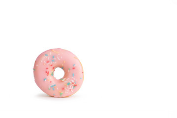 fresh pink donut with sprinkles against white Background
