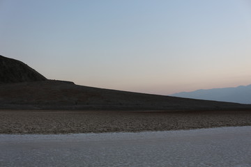 Badwater basin salt flats Death Valley at sunset in summer