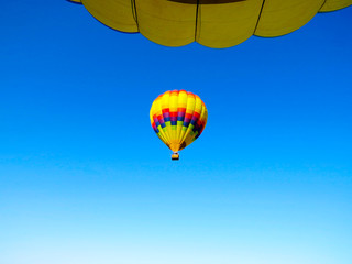 Beautiful colorful balloon flying in the blue sky
