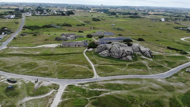 beautiful aerial drone shot of French Bretagne coastal region near Menez Ham. Visiting France for a unforgettable moment of romance, and tourism with wind and traditional food.