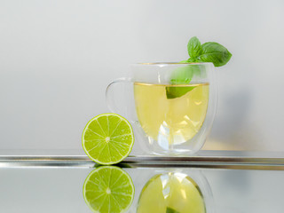 Fresh tea lemonade with mint leaves and lime