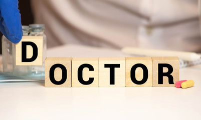 Cancer word on white paper is putted in a pocket of a doctor's wearing by hand in gloves white...