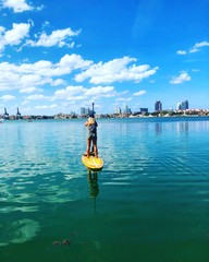 woman on sup board in Miami