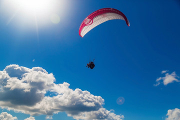 Paragliding in the sky on a sunny day.