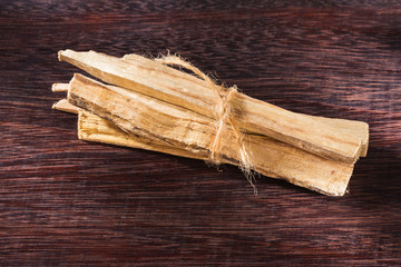 stack of palo santo wood on the table (Bursera graveolens)