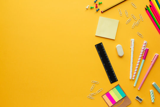 Stock photo of back to school concept with some stationery objects and copy space on the left
