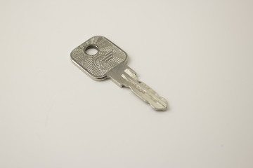 the key is silver on a white background