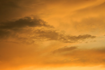 Naklejka na ściany i meble An orange and yellow sky with clouds. , Beautiful sky