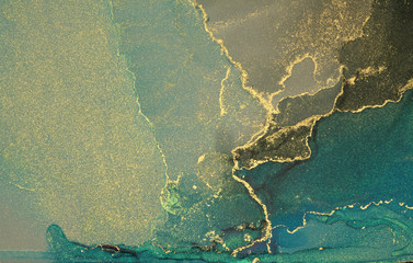 Abstract blue and gold glitter color background. Marble texture. Alcohol ink colors.