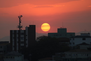 Fototapeta na wymiar sunset over the city close detail in sun