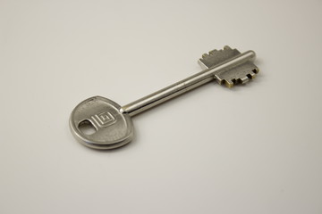 the key is silver on a white background