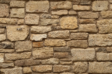 Gray stone wall made of natural stone