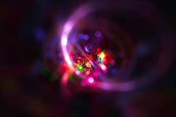 Abstract colorful light elements on dark background. 